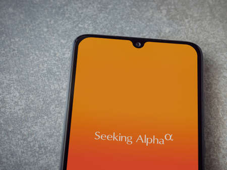Lod, Israel - July 8, 2020: Seeking Alpha app launch screen with logo on the display of a black...