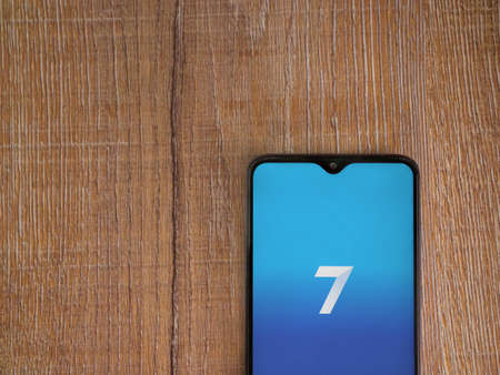 Lod, Israel - July 8, 2020: Seven app launch screen with logo on the display of a black mobile...