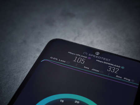 Lod, Israel - July 8, 2020: Speedtest app launch screen with logo on the display of a black mobile...