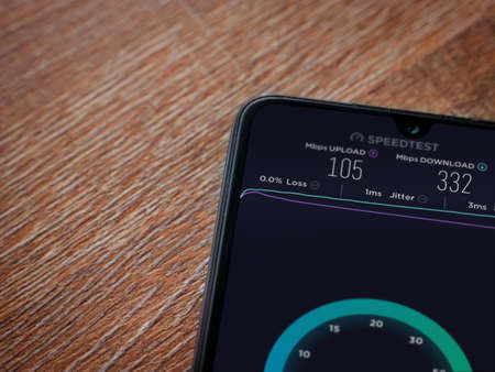 Lod, Israel - July 8, 2020: Speedtest app launch screen with logo on the display of a black mobile...