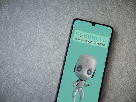 Lod, Israel - July 8, 2020: RoboHold app launch screen with logo on the display of a black mobile...