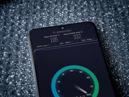 Lod, Israel - July 8, 2020: Speedtest app launch screen with logo on the display of a black mobile...