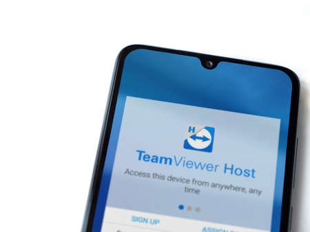 Lod, Israel - July 8, 2020: TeamViewer Host app launch screen with logo on the display of a black...