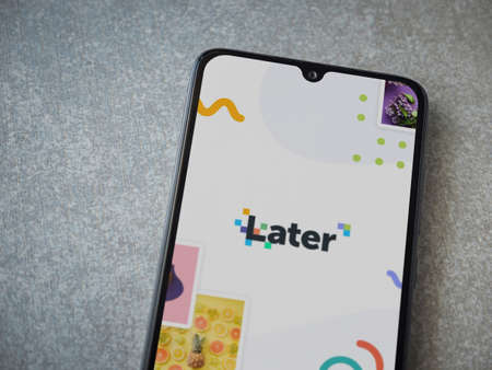 Lod, Israel - July 8, 2020: Later app launch screen with logo on the display of a black mobile smartphone on ceramic stone background. Top view flat lay with copy space.のeditorial素材
