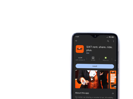 Lod, Israel - July 16,2023: SIXT rent app play store page on smartphone on white background. Top view flat lay with copy space.のeditorial素材