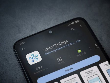 Lod, Israel - July 16,2023: Smartthings app play store page on smartphone on a dark marble stone background. Top view flat lay with copy space.のeditorial素材