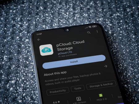 Lod, Israel - July 16,2023: pCloud app play store page on smartphone on a metallic background. Close up top view flat lay.のeditorial素材
