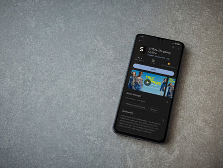 Lod, Israel - July 16,2023: Shein app play store page on smartphone on ceramic stone background. Top view flat lay with copy space.のeditorial素材