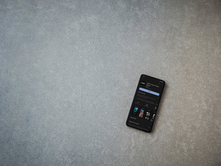 Lod, Israel - July 16,2023: GoPro Quik - Video Editor app play store page on smartphone on ceramic stone background.. Top view flat lay with copy space.のeditorial素材