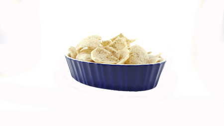 Pile of Crisp rice in blue bowl on white background