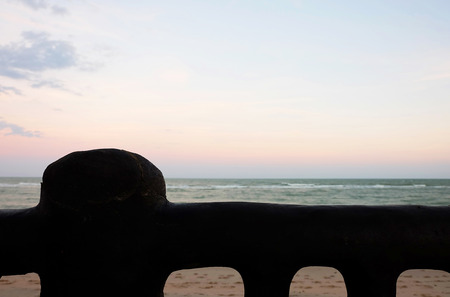 A Beach with silhouette fence in the frontの写真素材