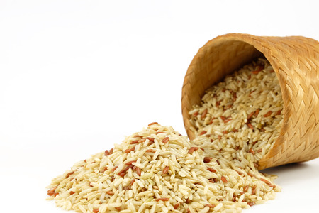 Raw Brown rice in bamboo box  (Kratip) on white backgroundの写真素材