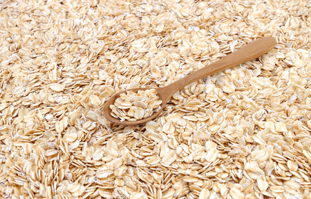 Whole muesli oat with wooden spoon ON TOPの写真素材