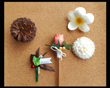 Christmas ornaments decoration on cork board with black borderの写真素材
