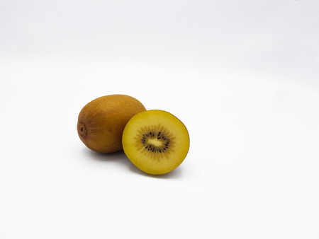 Cross section of green Kiwi lay on white backgroundの写真素材