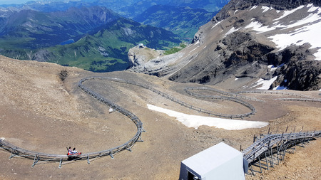 Alpine coaster on snow mountain with wide scenic viewの写真素材