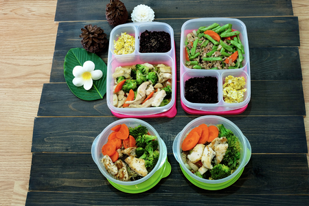 Homemade boxes of clean food, meal preparation for healthy diet on wooden backgroundの写真素材