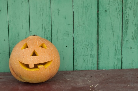 Halloween pumpkin on the benchの写真素材