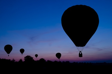Silhouette of the hot air balloon on a sunset background. の写真素材