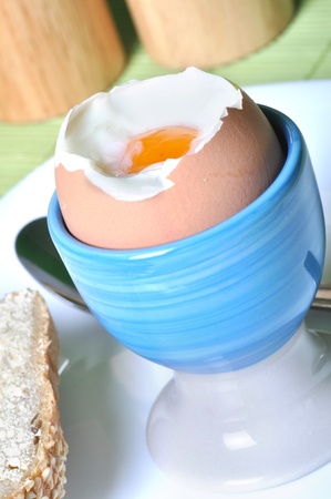 Boiled egg in eggcup. Traditional and healthy breakfast.の写真素材