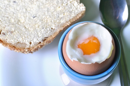Boiled egg in eggcup. Traditional and healthy breakfast.の写真素材