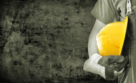 Worker and grunge texture in background  Concept of OSH  occupational safety and health の写真素材