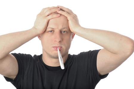 Man holding head in headache with thermometer in mouth  Isolated on white background