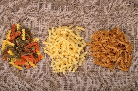 three types of pasta on burlap canvasの写真素材