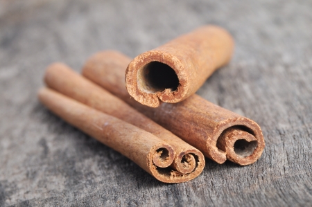 Stack of cinnamon stickson a wooden tableの写真素材
