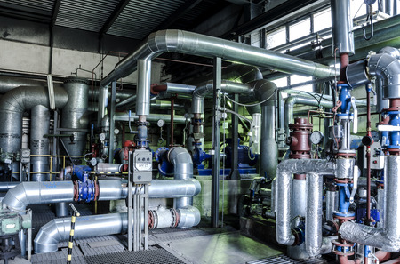 Equipment, cables and piping as found inside of a thermal power station.
