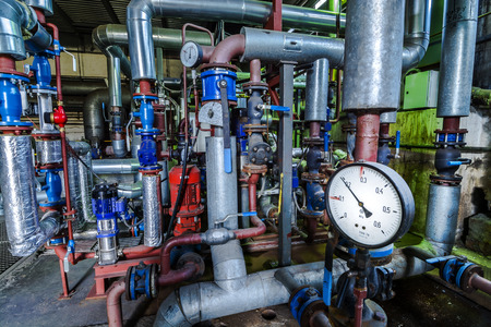 Equipment, cables and piping as found inside of a thermal power station.の写真素材