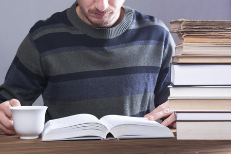 Young man reading a book.の写真素材