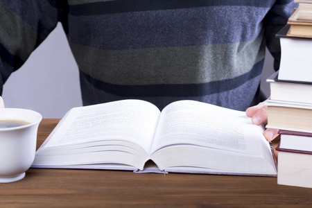 Young man reading a book.の写真素材