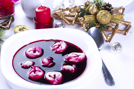 Red borsch with uszka (kind of traditional dumplings), traditional Christmas Eve dishの写真素材