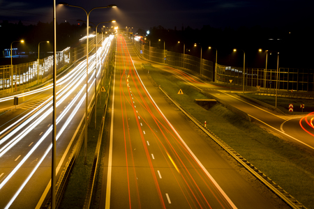 Car lights on a highway at nightの写真素材