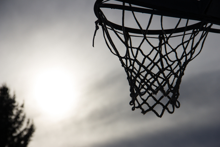 Basket silhuette against a cloudy skyの写真素材