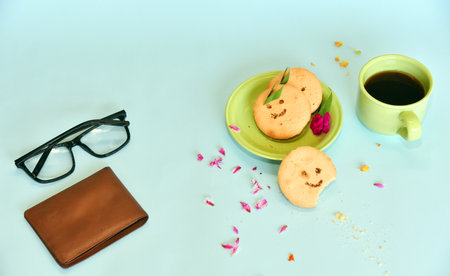 Smiling face cookies isolated with a blue light backgroundの写真素材