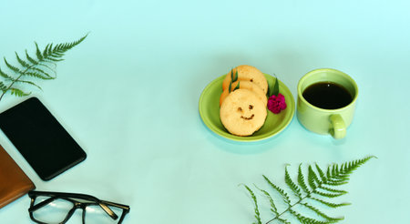 Smiling face cookies isolated with a blue light backgroundの写真素材