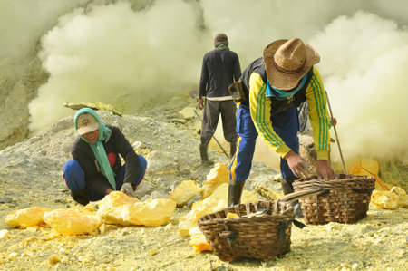 Banyuwangi,Indonesia-February 07,2015: Activities of the workers on the mount Ijen, collecting and carrying the sulphur from the craterのeditorial素材