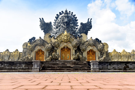 TABANAN,BALI,INDONESIA-JULY 08 2021:  Garuda Wisnu Kencana statue at Bung Karno Park, with beautiful blue sky during nice weatherのeditorial素材