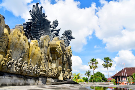 TABANAN,BALI,INDONESIA-JULY 08 2021:  Garuda Wisnu Kencana statue at Bung Karno Park, with beautiful blue sky during nice weatherのeditorial素材