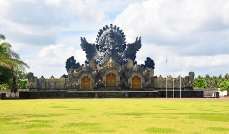 TABANAN,BALI,INDONESIA-JULY 08 2021:  Garuda Wisnu Kencana statue at Bung Karno Park, with beautiful blue sky during nice weatherのeditorial素材
