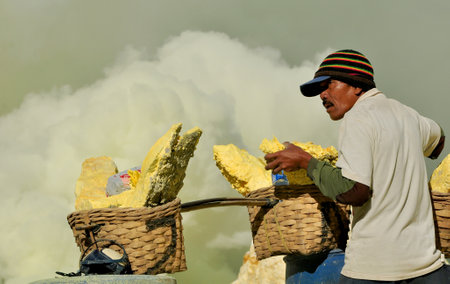 Banyuwangi,Indonesia-February 07,2015: Activities of the workers on the mount Ijen, collecting and carrying the sulphur from the craterのeditorial素材