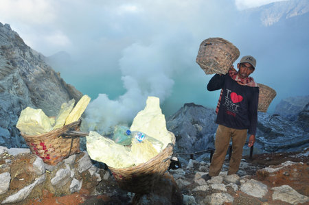 Banyuwangi,Indonesia-February 07,2015: Activities of the workers on the mount Ijen, collecting and carrying the sulphur from the craterのeditorial素材
