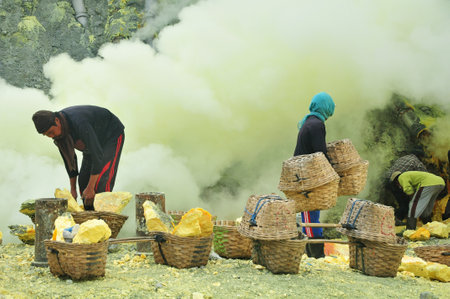 Banyuwangi,Indonesia-February 07,2015: Activities of the workers on the mount Ijen, collecting and carrying the sulphur from the craterのeditorial素材