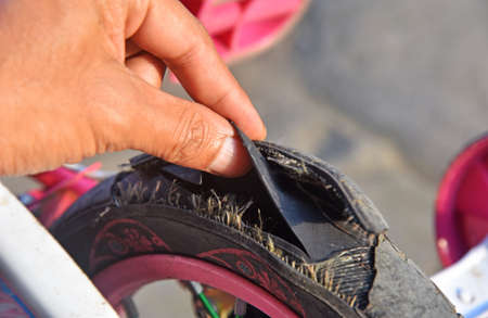 Broken kids bicycle tire need a maintenance