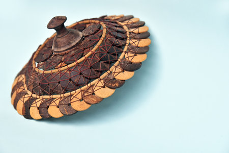 Basket Cover,hand made from coconut shell in brown color isolated on color background,concept of hand made product and earth friendlyの写真素材