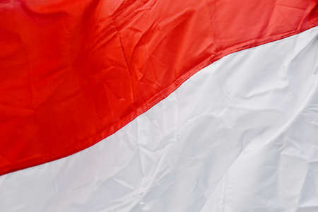Indonesian Flag,Red and White color,( Bendera Merah Putih),Indonesian independence day, against sky.の写真素材