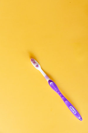 BALI,INDONESIA-AUGUST 09 2021: Tooth brush for adult on yellow backgroundのeditorial素材