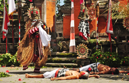 BALI,INDONESIA-FEBRUARY 04 2015: Barong and Kris dance performing on the stage, showing dancers with colorful costume during day timeのeditorial素材
